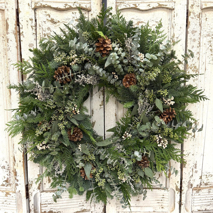 White Winter Wreath - Creekside Farms A stunning combination of fresh greens, pine cones, and white accents wreath 18"/22"/26"