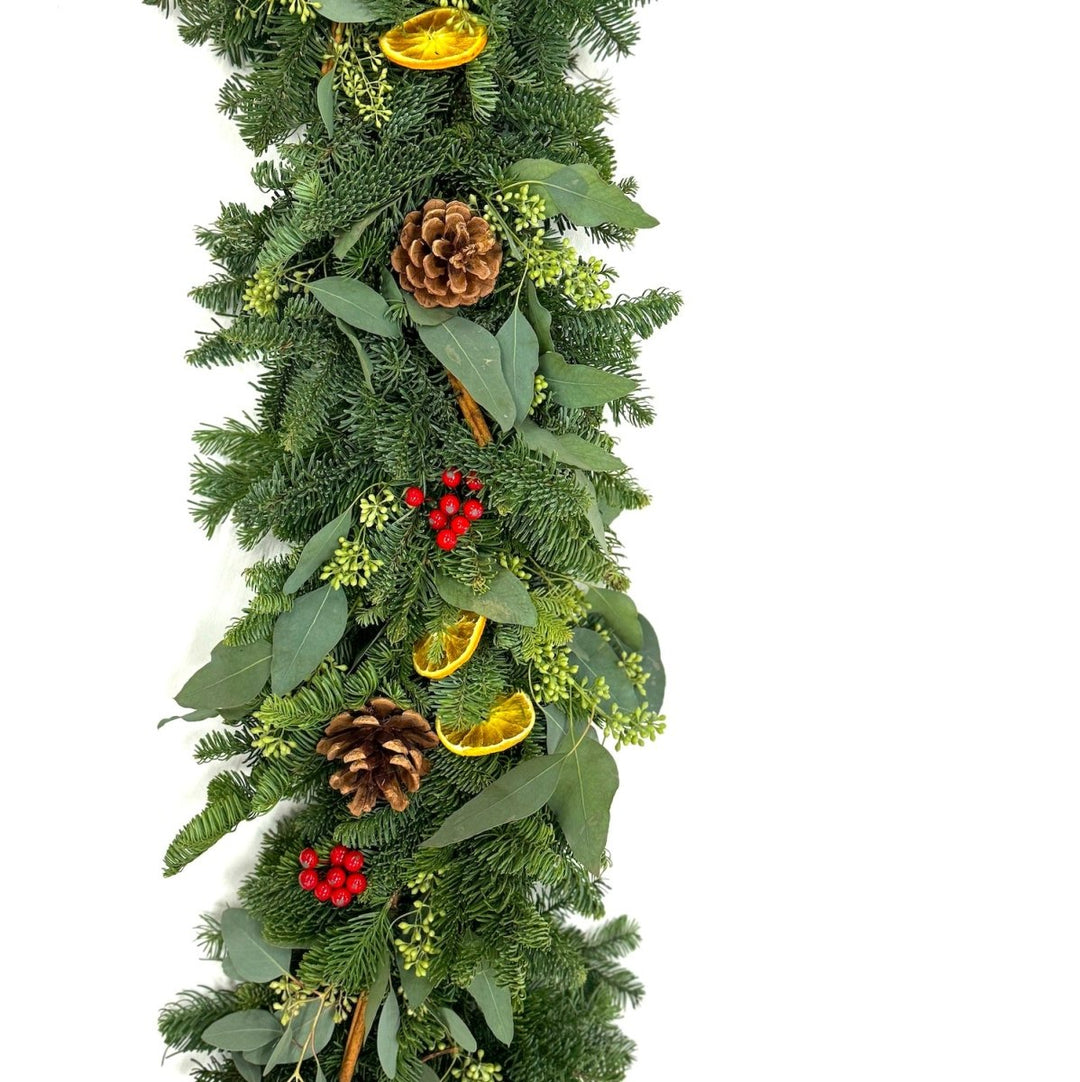 Citrus Berry Garland 6' - Creekside Farms Fragrant, bright and cheerful natural garland made with fir and eucalyptus and natural orange slices and cinnamon sticks, with faux red berries 6'.