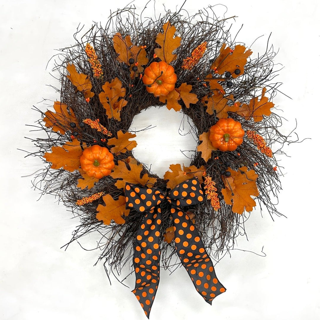 Enchanting Halloween Wreath - Creekside Farms Halloween wreath made with pumpkins, orange and black berries, fall leaves and finished with a bold Halloween ribbon 22"