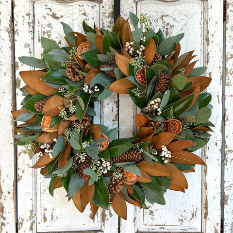 Holiday Magnolia Wreath - Creekside Farms Fresh Magnolia and seeded eucalyptus with orange and white accents wreath 18"/22"