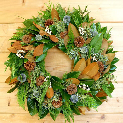 Magnolia Woodsy Wreath - Creekside Farms Stunning magnolia & greens with tallow berries, pine cones & hints of blue wreath 20"/22"/26"
