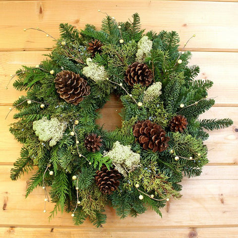 Pine Cone and Berry Wreath - Creekside Farms A beautiful combination of fresh greens, pine cones, natural moss and a touch of faux berries wreath 20"