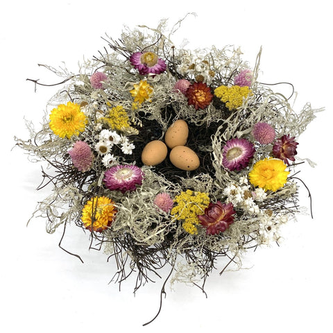 Spring Meadow Nest - Creekside Farms Vibrant flowers and faux eggs enrich a mossy twig nest 11"