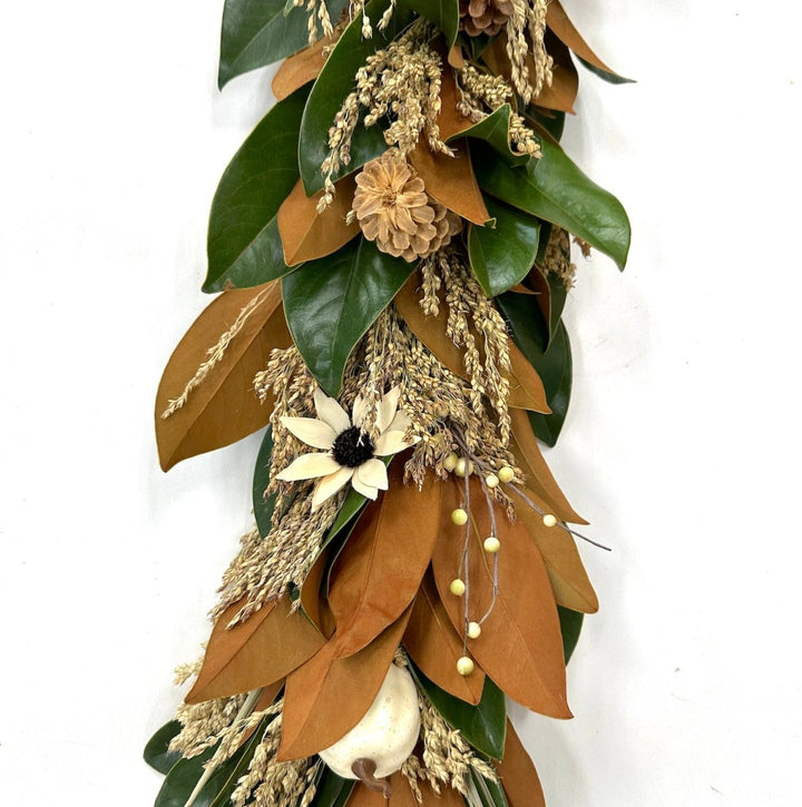 White Pumpkin Magnolia Garland 6' - Creekside Farms Beautiful mix of fresh magnolia & grains with faux white pumpkins, pine cones & wooden sunflowers garland 6'