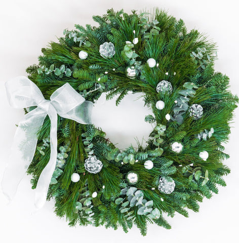Winter Wonderland Wreath - Creekside Farms Wonderful combination of fresh pine, fir and eucalyptus with silver and white ornaments, pine cones and silver bow wreath 22"